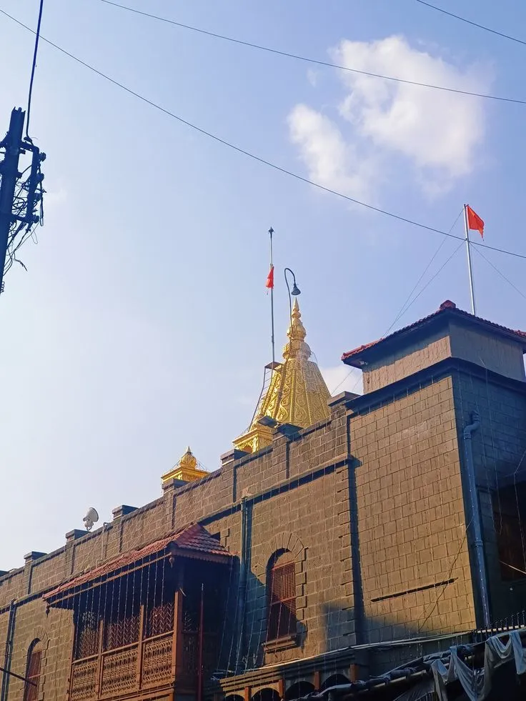 Shirdi Sai Baba Temple with golden dome under clear sky